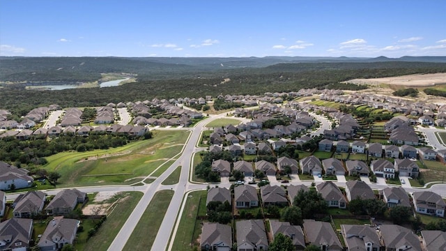 7901 Arbor Knoll Ct, Lago Vista, TX 78645 - aerial overview of property's location featuring nearby suburban area and mountains