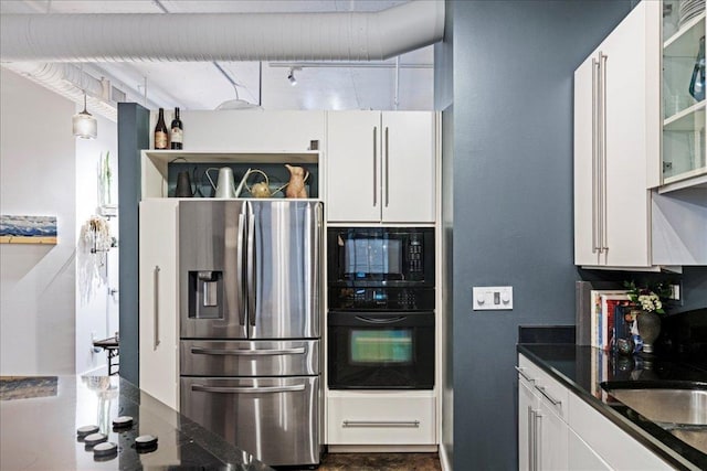 311 W 5th St Unit 1008, Austin, TX 78701 - kitchen featuring black appliances, white cabinets, and glass insert cabinets