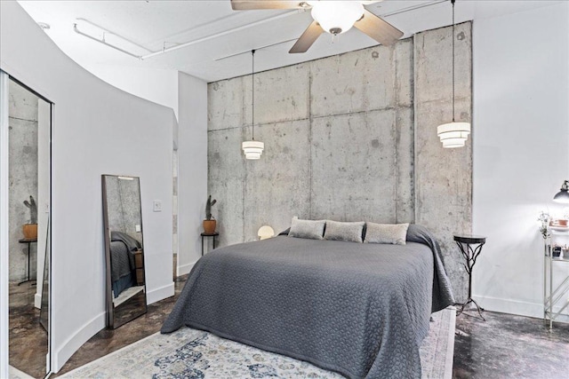 311 W 5th St Unit 1008, Austin, TX 78701 - bedroom with concrete flooring and a ceiling fan