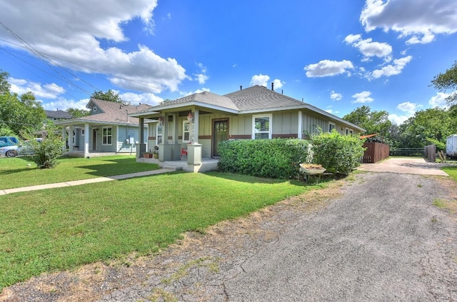 2106 San Jose St, Georgetown, TX 78626 - bungalow-style house featuring board and batten siding, driveway, a porch, and roof with shingles
