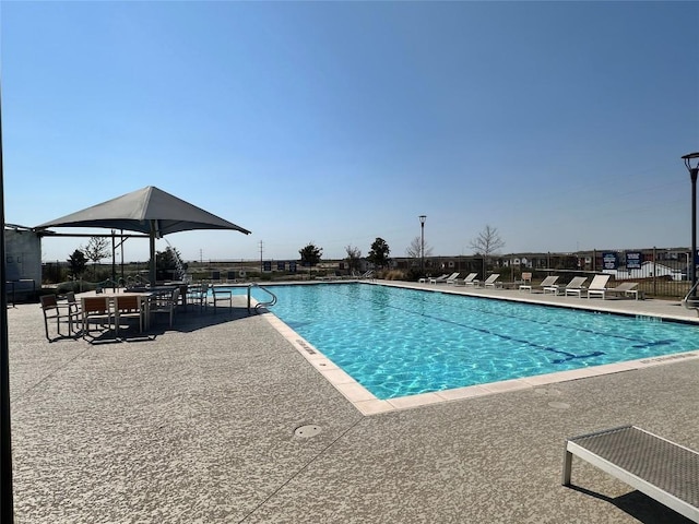 125 Duck Creek Trl, San Marcos, TX 78666 - community pool with a patio area