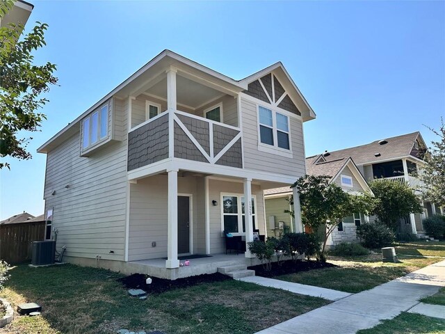 125 Duck Creek Trl, San Marcos, TX 78666 - view of front of house featuring a porch, a balcony, and a front lawn