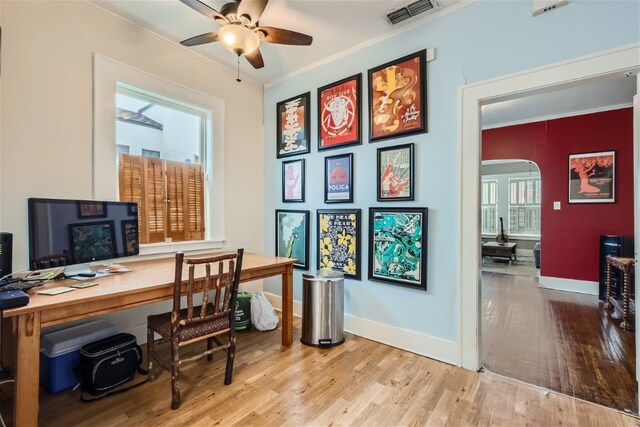 1508 Pease Rd, Austin, TX 78703 - home office featuring crown molding, wood finished floors, arched walkways, and ceiling fan