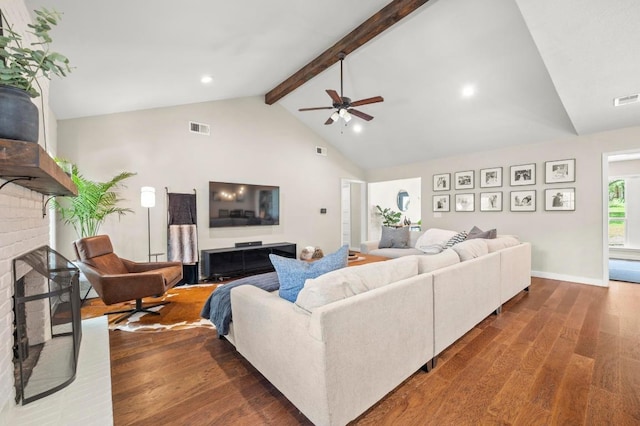 8714 Silverhill Ln, Austin, TX 78759 - living room featuring wood finished floors, beamed ceiling, a brick fireplace, a ceiling fan, and high vaulted ceiling