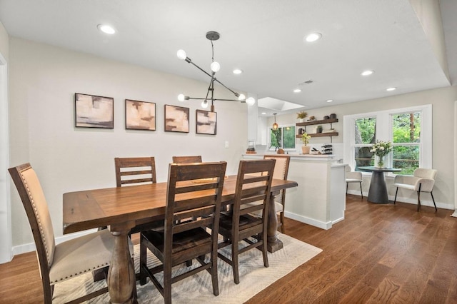 8714 Silverhill Ln, Austin, TX 78759 - dining space with dark wood-style floors, recessed lighting, and a chandelier