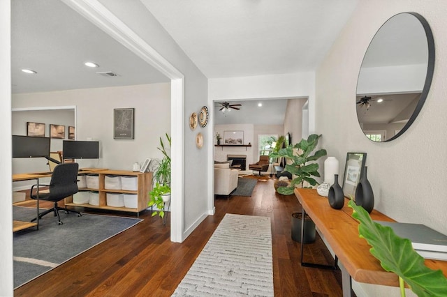 8714 Silverhill Ln, Austin, TX 78759 - office with a fireplace, dark wood-style floors, a ceiling fan, and recessed lighting