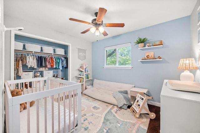 8714 Silverhill Ln, Austin, TX 78759 - bedroom featuring a closet, ceiling fan, and wood finished floors