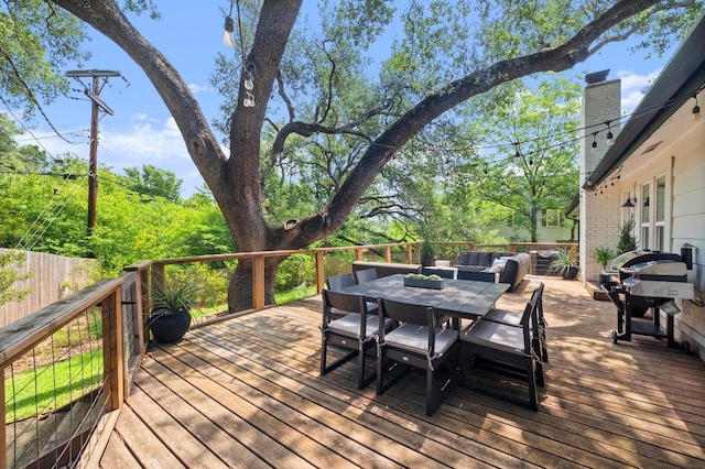8714 Silverhill Ln, Austin, TX 78759 - wooden deck with outdoor dining area and area for grilling