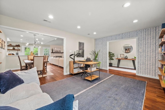 8714 Silverhill Ln, Austin, TX 78759 - living room with wallpapered walls, an accent wall, wood finished floors, and recessed lighting