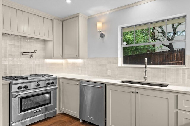 406 N Coronado Dr, Kerrville, TX 78028 - kitchen with appliances with stainless steel finishes, tasteful backsplash, ornamental molding, dark wood-style floors, and light stone counters