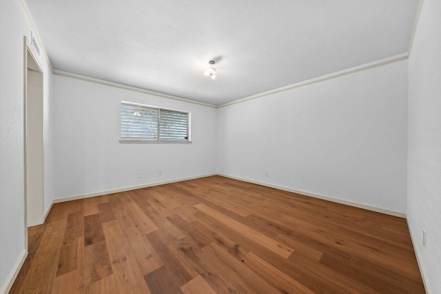 406 N Coronado Dr, Kerrville, TX 78028 - empty room with wood finished floors and crown molding