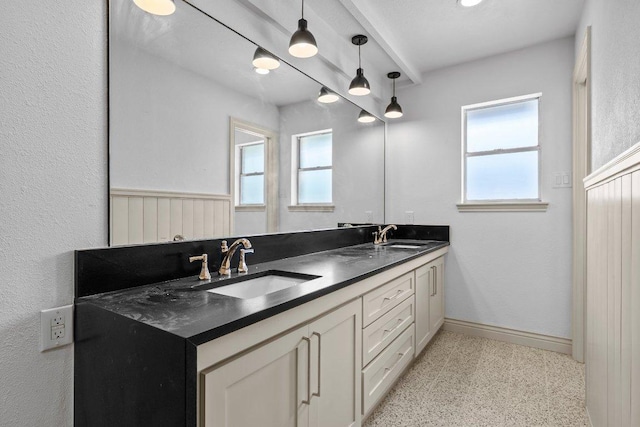 406 N Coronado Dr, Kerrville, TX 78028 - full bathroom featuring double vanity, healthy amount of natural light, and speckle patterned floor
