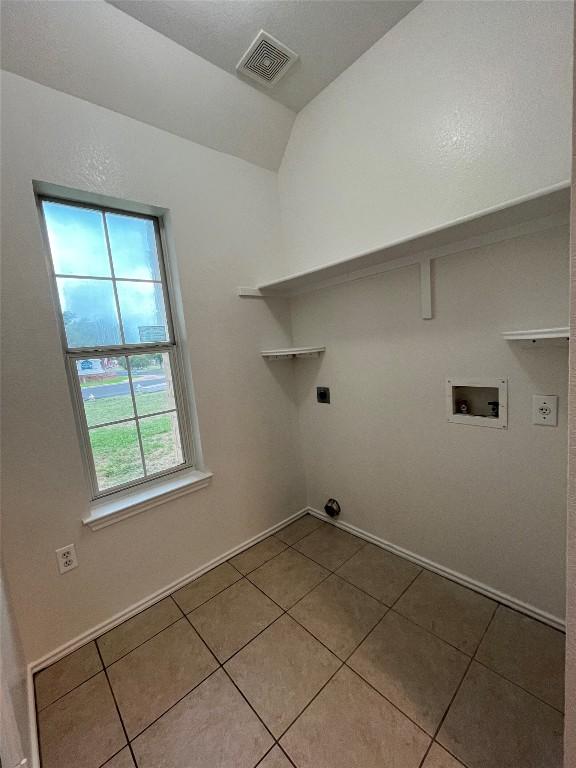 3016 Aftonshire Way, Austin, TX 78748 - laundry area featuring hookup for a washing machine, tile patterned flooring, and hookup for an electric dryer