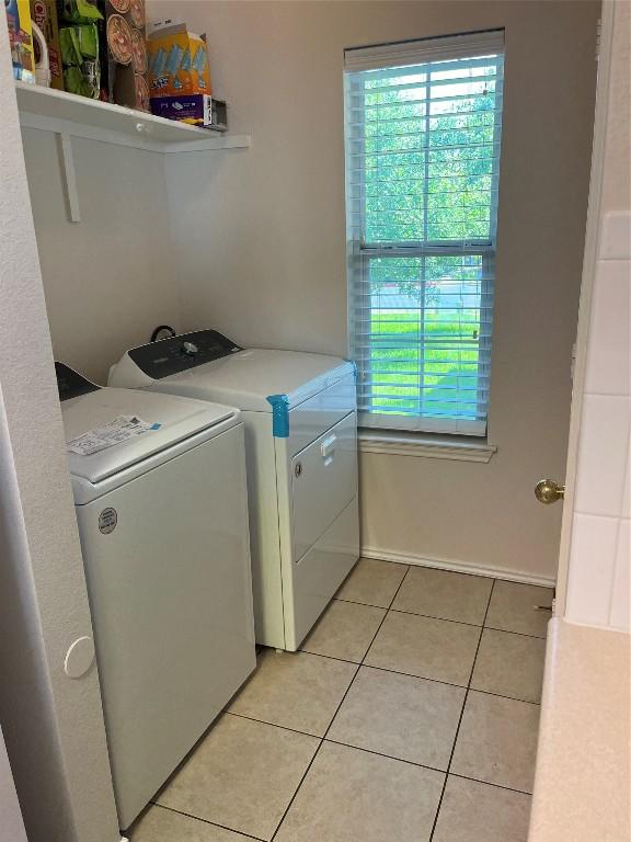 3016 Aftonshire Way, Austin, TX 78748 - laundry room with healthy amount of natural light, separate washer and dryer, and light tile patterned floors