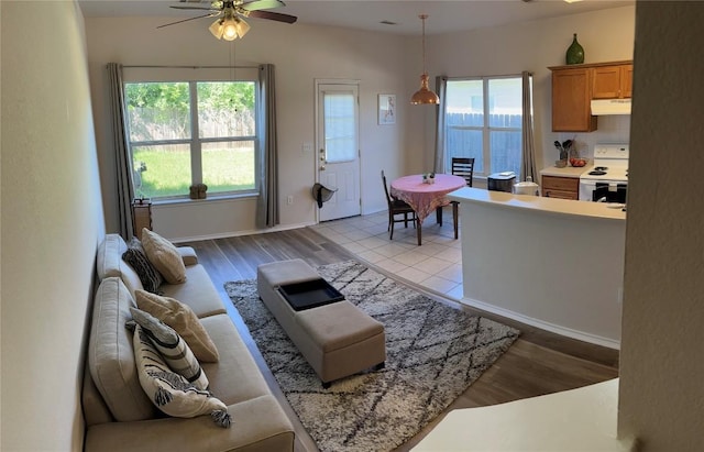 3016 Aftonshire Way, Austin, TX 78748 - living area featuring a ceiling fan and light wood finished floors