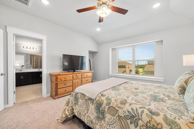 1516 Honaker Way, Leander, TX 78641 - bedroom featuring vaulted ceiling, recessed lighting, light carpet, ensuite bathroom, and a ceiling fan