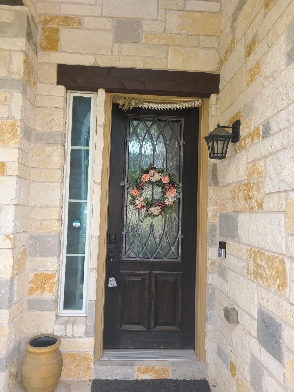 608 Cascada Ln, Round Rock, TX 78681 - view of exterior entry featuring stone siding