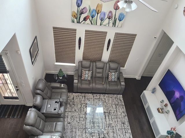 608 Cascada Ln, Round Rock, TX 78681 - living area featuring wood finished floors, ceiling fan, and a towering ceiling