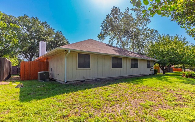 1007 Markham Ln Unit A, Austin, TX 78753 - back of house with a chimney