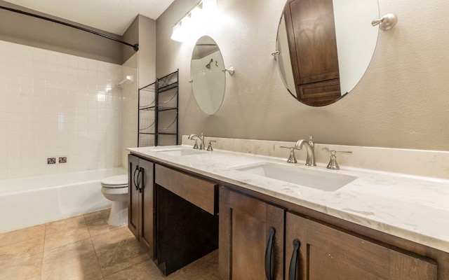 1007 Markham Ln Unit A, Austin, TX 78753 - full bath with double vanity, shower / bath combination, tile patterned floors, and a textured wall