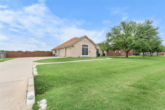 3516 Valley Mist Ct, Temple, TX 76502 - view of side of property with driveway, an attached garage, and a lawn