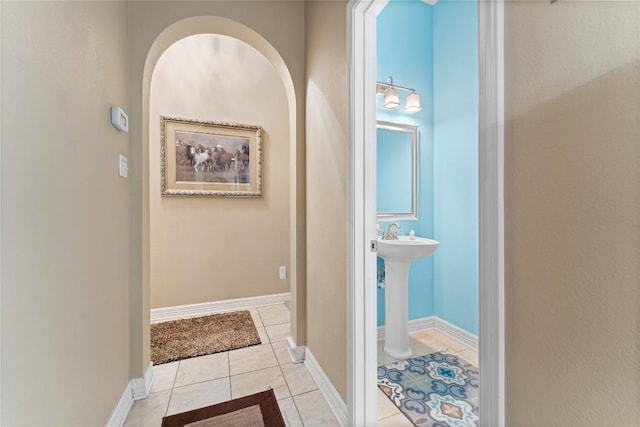 3516 Valley Mist Ct, Temple, TX 76502 - hallway featuring light tile patterned flooring and arched walkways