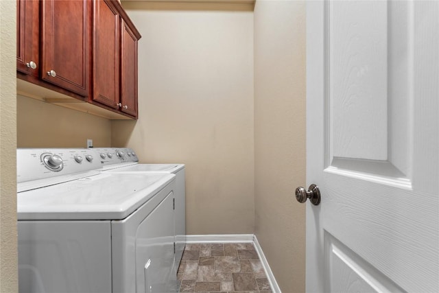 3516 Valley Mist Ct, Temple, TX 76502 - laundry room with washer and clothes dryer, cabinet space, and stone finish floors