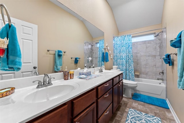 3516 Valley Mist Ct, Temple, TX 76502 - full bathroom featuring shower / bathtub combination with curtain, double vanity, vaulted ceiling, and stone finish flooring