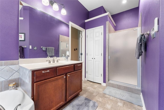 3516 Valley Mist Ct, Temple, TX 76502 - bathroom with a shower stall, vanity, a garden tub, a closet, and stone finish flooring