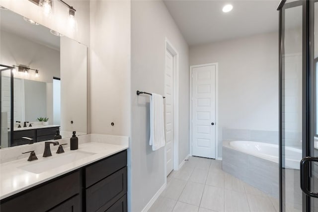 2624 San Bautista Way Unit 44, Leander, TX 78641 - full bath featuring tile patterned flooring, vanity, a bath, and recessed lighting