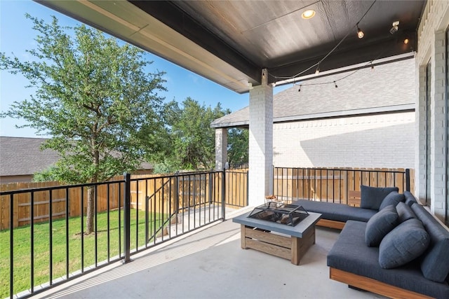 2624 San Bautista Way Unit 44, Leander, TX 78641 - fenced backyard featuring an outdoor fire pit and a patio