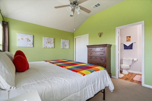 2321 Kale Dr, Austin, TX 78725 - carpeted bedroom featuring lofted ceiling, ensuite bathroom, and ceiling fan