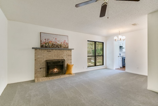 8702 Wildridge Dr, Austin, TX 78759 - unfurnished living room featuring carpet floors, ceiling fan, a chandelier, a fireplace, and a textured ceiling