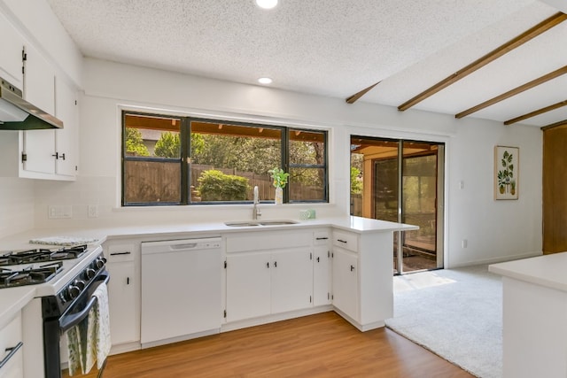 8702 Wildridge Dr, Austin, TX 78759 - kitchen with dishwasher, black gas range, recessed lighting, light countertops, and white cabinets