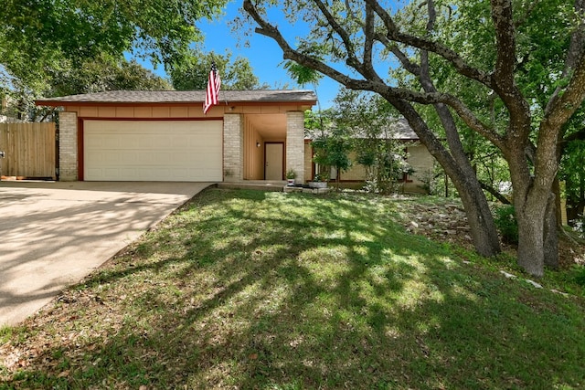 8702 Wildridge Dr, Austin, TX 78759 - view of front of property with brick siding, a garage, and driveway