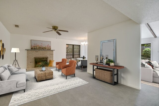 8702 Wildridge Dr, Austin, TX 78759 - carpeted living room with ceiling fan, a fireplace, a chandelier, and a textured ceiling