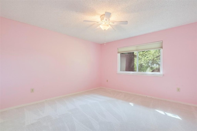 7507 Valburn Dr, Austin, TX 78731 - empty room featuring light colored carpet, a ceiling fan, and a textured ceiling