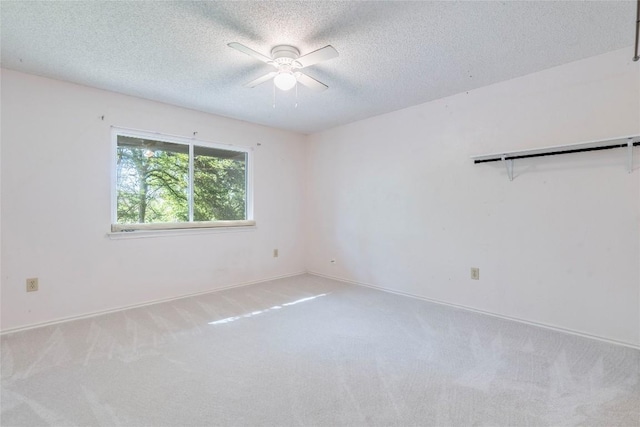 7507 Valburn Dr, Austin, TX 78731 - unfurnished room with ceiling fan, carpet, and a textured ceiling