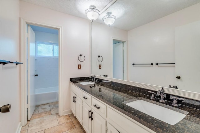 7507 Valburn Dr, Austin, TX 78731 - bathroom with double vanity and a textured ceiling