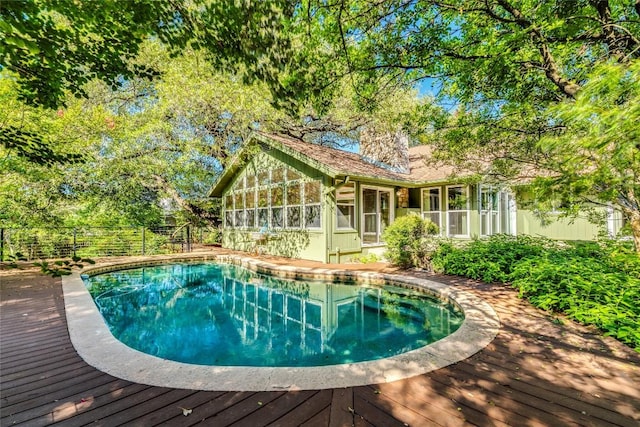 7507 Valburn Dr, Austin, TX 78731 - view of pool featuring a fenced backyard, a sunroom, and a wooden deck