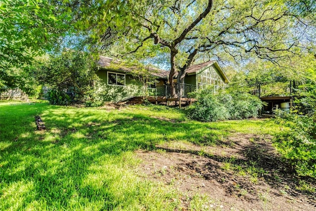 7507 Valburn Dr, Austin, TX 78731 - view of green lawn featuring a wooden deck