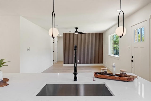 5603 Darlington Ln, Austin, TX 78723 - kitchen view of pendant lighting, a ceiling fan, and wood finished floors