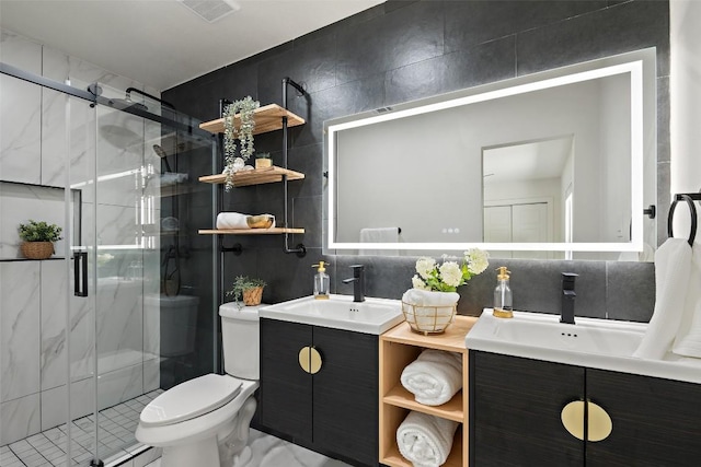 5603 Darlington Ln, Austin, TX 78723 - bathroom with double vanity, tile walls, and a stall shower