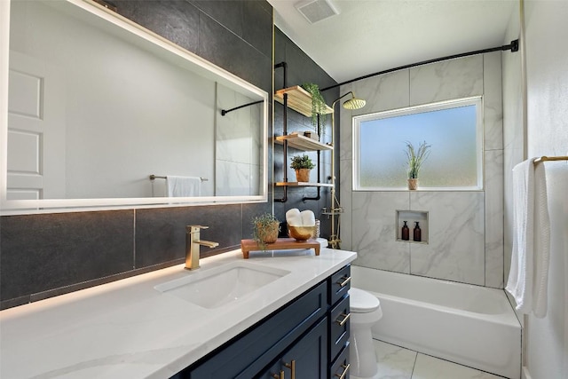 5603 Darlington Ln, Austin, TX 78723 - full bathroom featuring vanity, shower / tub combination, and marble finish flooring