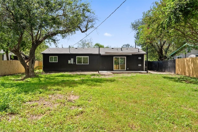 5603 Darlington Ln, Austin, TX 78723 - rear view of house with a fenced backyard and a patio area