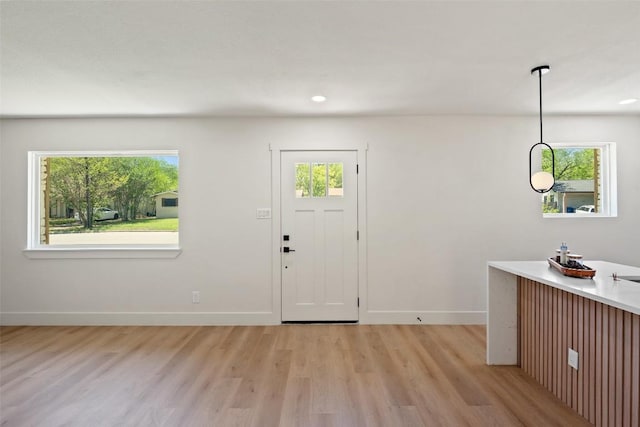 5603 Darlington Ln, Austin, TX 78723 - entryway with light wood-style flooring, healthy amount of natural light, and recessed lighting