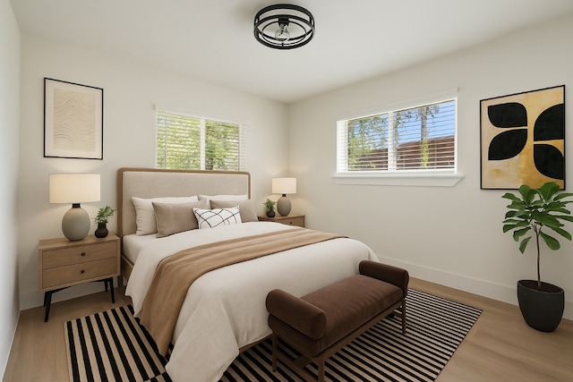 5603 Darlington Ln, Austin, TX 78723 - bedroom with multiple windows and wood finished floors