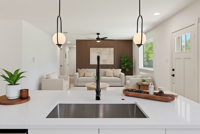 5603 Darlington Ln, Austin, TX 78723 - kitchen with light countertops, decorative light fixtures, open floor plan, and recessed lighting