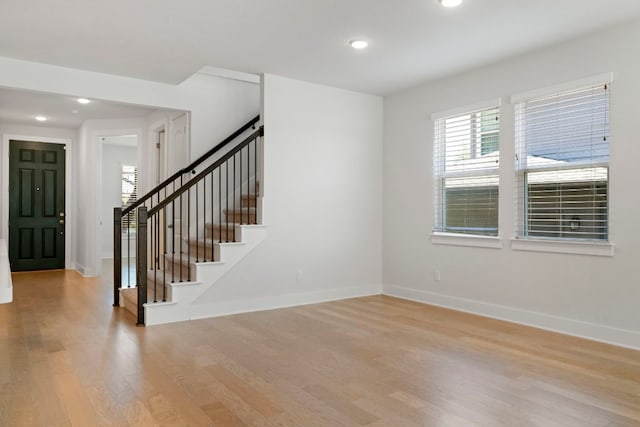 265 Tierra Trl, Dripping Springs, TX 78620 - entrance foyer with light wood finished floors, stairs, and recessed lighting