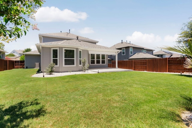 265 Tierra Trl, Dripping Springs, TX 78620 - rear view of house with a patio, a fenced backyard, and roof with shingles